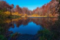Mountain lake in the autumn season, colorful trees Royalty Free Stock Photo