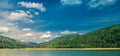 Mountain Lake with blue mountains in the background