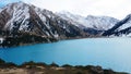 A mountain lake with blue water in winter