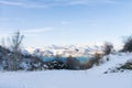 Mountain lake Charvak in Uzbekistan on a snowy frosty day, surrounded by the Tien Shan mountains Royalty Free Stock Photo