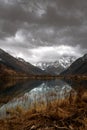 Mountain lake with dramaic sky at sunset Royalty Free Stock Photo