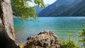 Mountain lake Kolsay with floating boats. Royalty Free Stock Photo