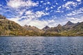 Mountain Lake Landscape. Mountain Range panorama with beautiful clouds in blue sky Royalty Free Stock Photo