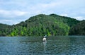 Mountain Lake / Man Kayaking