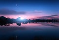 Mountain lake with moonrise at night. Night landscape