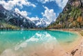 Mountain lake with reflection at sunset in autumn in Dolomites