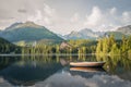 Horské jazero Štrbské Pleso s loďkou v popredí v Národnom parku Vysoké Tatry. Slovensko, Európa. Neskoro