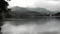 A mountain lake in a summer mist