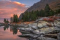 Mountain Lake Sunset Coast With Pine Forest And Rocks, Altai Mountains Highland Nature Autumn Landscape Photo Royalty Free Stock Photo