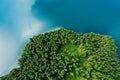 Mountain lake with turquoise water and green trees. Reflection in the water. Beautiful summer landscape with mountains, forest and Royalty Free Stock Photo