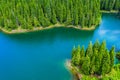 Mountain lake with turquoise water and green trees. Reflection in the water. Beautiful summer landscape with mountains, forest and Royalty Free Stock Photo