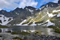 The mountain lake Vel`ke Hincovo pleso with the Mengusovske mountains in the High Tatras