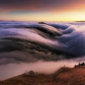 Mountain landscape above clouds at sunset in Slovakia with forest and sun