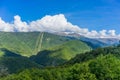 Mountain landscape against cloudy blue sky Royalty Free Stock Photo