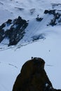 Alpinist climbing Aiguille du Midi at 3842m, Mont Blanc massif Royalty Free Stock Photo