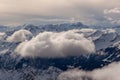 Mountain landscape in the Alps - white clouds between the peaks Royalty Free Stock Photo