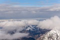 Mountain landscape in the Alps - white clouds between the peaks Royalty Free Stock Photo