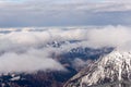 Mountain landscape in the Alps - white clouds between the peaks Royalty Free Stock Photo