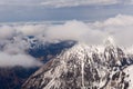 Mountain landscape in the Alps - white clouds between the peaks Royalty Free Stock Photo