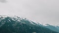 Mountain landscape.Austria.Hohe Tauern region.Beautiful mountain landscape with cloudy sky.Snowy mountain peaks in gray