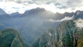 Mountain landscape background with peruvian Andes mountains in the clouds