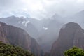 Mountain landscape background with peruvian Andes mountains in the clouds