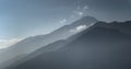 Mountain landscape in blue haze and silhouette in the Rhine Valley in Switzerland