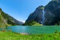 Mountain landscape with clear turquoise lake and waterfall in the Alps. Zillertal Alps Nature Park, Austria