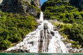 Mountain landscape with cloudy sky. Beautiful nature Norway. Geiranger fjord. Seven Sisters Waterfall Royalty Free Stock Photo