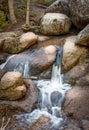 Mountain landscape. Creek, stream, spring in the woods, forest. Big rocks. Silky smooth flowing water. Vedauwoo National Park, Wyo