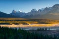 Mountain landscape at dawn. Sunbeams in a valley. Rivers and forest in a mountain valley at dawn. Natural landscape with bright su