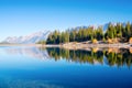 Mountain landscape at the day time. Lake and forest in a mountain valley. Natural landscape with a blue sky. Reflections on the su Royalty Free Stock Photo