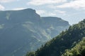 Mountain landscape with deep gorge. mountains, green pass. Picturesque scenery with beautiful hills and rocks. Colorful view to