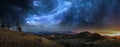 Mountain landscape fantastic cosmos galaxies stars planets and nebulae. Sunset and unreal night sky. Panoramic photo mountains