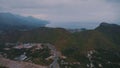 Mountain landscape. Flight and video footage from the drone of the resort town. Sunset sky. Big road. Highway