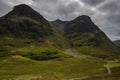 Mountain landscape in Glen Coe with dark clouds hanging over the peaks, Highland, Scotland Royalty Free Stock Photo