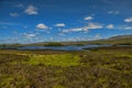 Mountain landscape in the Glencoe area in Scotland, Springtime view mountains with grassland and countryside road in the valley of Royalty Free Stock Photo