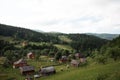 Mountain landscape, houses on mountain green hills and blue sky Royalty Free Stock Photo