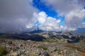 Mountain landscape on the island of Crete in Greece, high in the mountains, with blue sky and clouds reaching to the Royalty Free Stock Photo