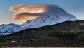 Mountain landscape - lenticular clouds over volcano at sunset Royalty Free Stock Photo