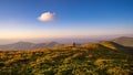 Lonely walker in a mountain path under a single cloud Royalty Free Stock Photo