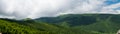 Mountain landscape and low clouds, panorama Royalty Free Stock Photo