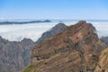 Mountain landscape with low-slung clouds at Madeira seen from Pico do Arieira