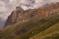 Mountain landscape - majestic colorful orange rocky bizarre cliff of canyon in bright sunny autumn day, white clouds in blue sky