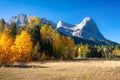 Mountain landscape in the morning. Sunbeams in a valley. Field and forest in a mountain valley. Natural landscape with bright suns