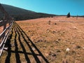 Mountain landscape next to a fancy fence