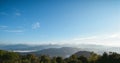 Mountain landscape panorama view and bright blue sky., blue sky background with tiny clouds Royalty Free Stock Photo