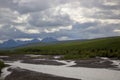 Mountain landscape with river and clouds in Denali National Park and Preserve Royalty Free Stock Photo