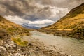 A mountain landscape and river on a cloudy day in New Zealand near Omarama Royalty Free Stock Photo