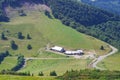 Mountain landscape with road and cottages.Village in mountain va